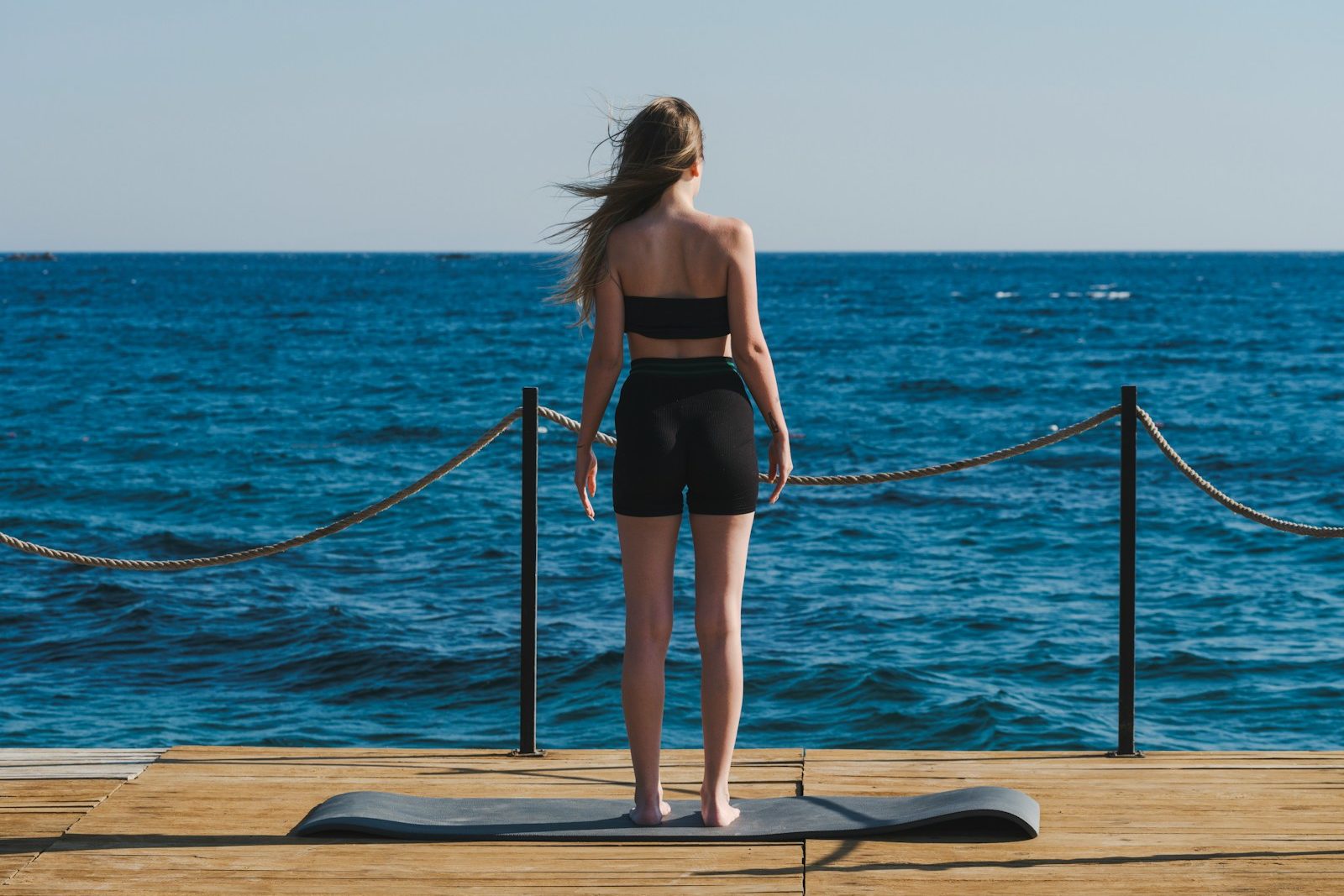 a person standing on a surfboard